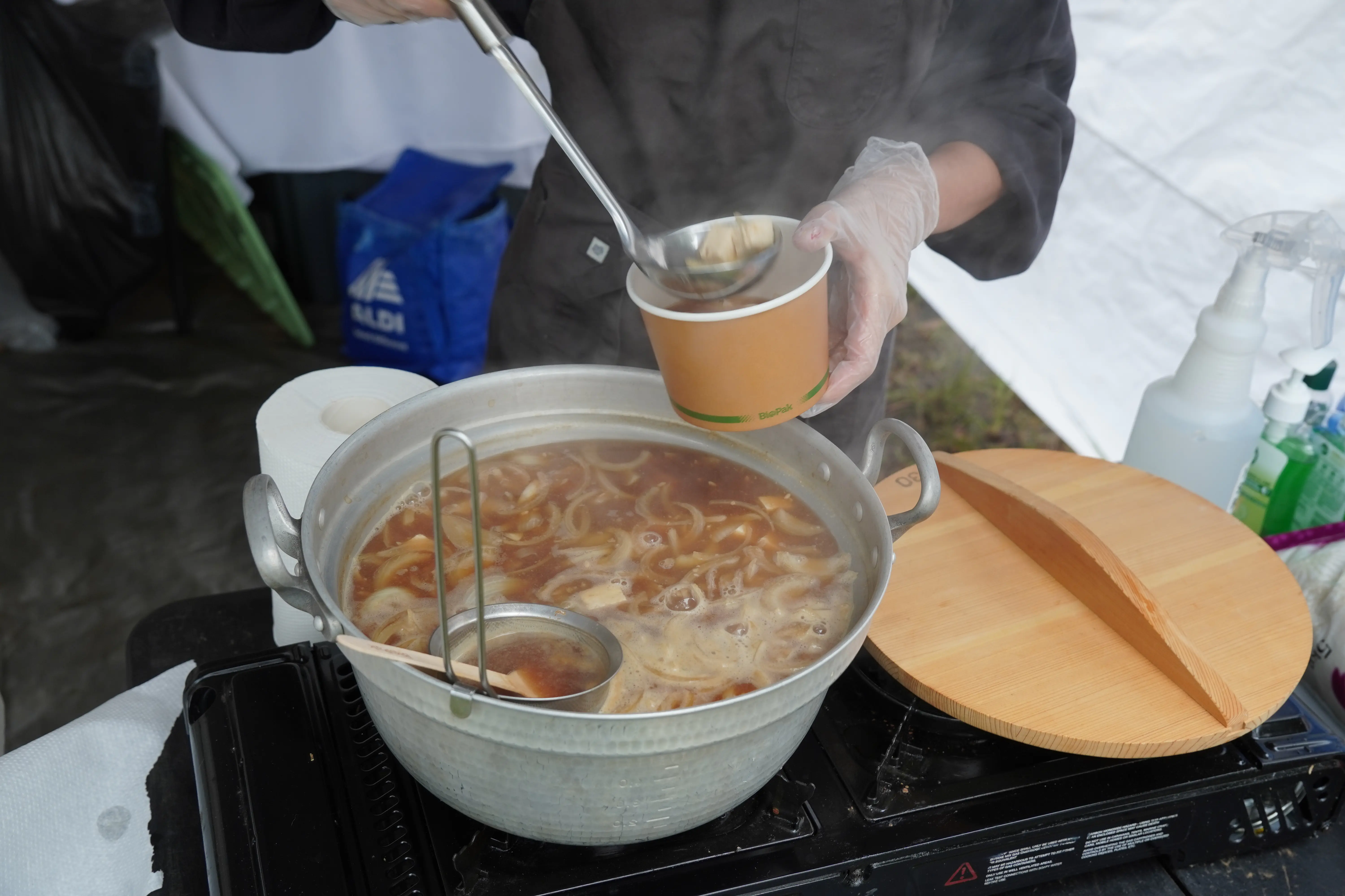 Adding miso soup into a bowl