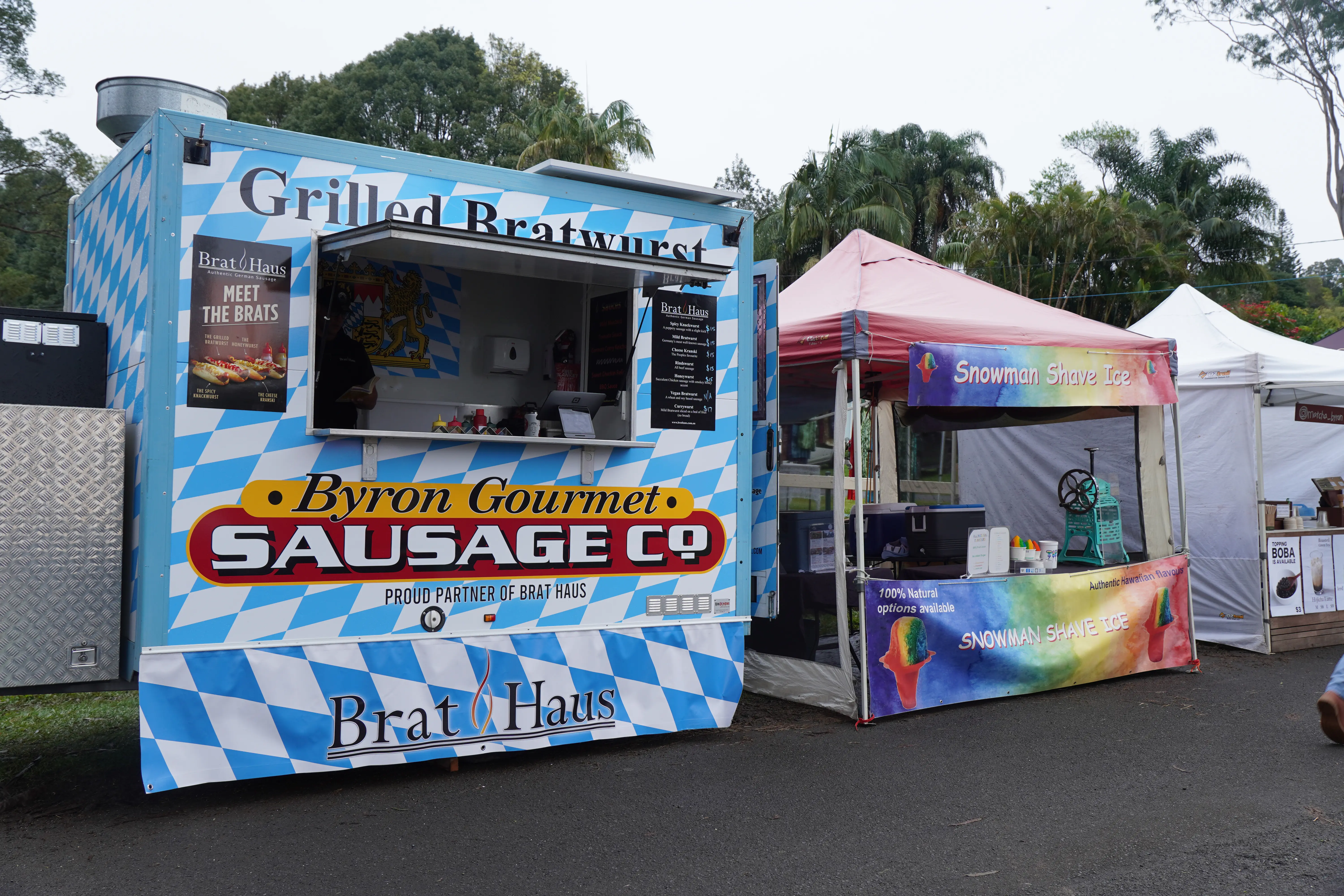 Byron Sausage Co and Snowman Shaved Ice stalls at Bangalow Markets