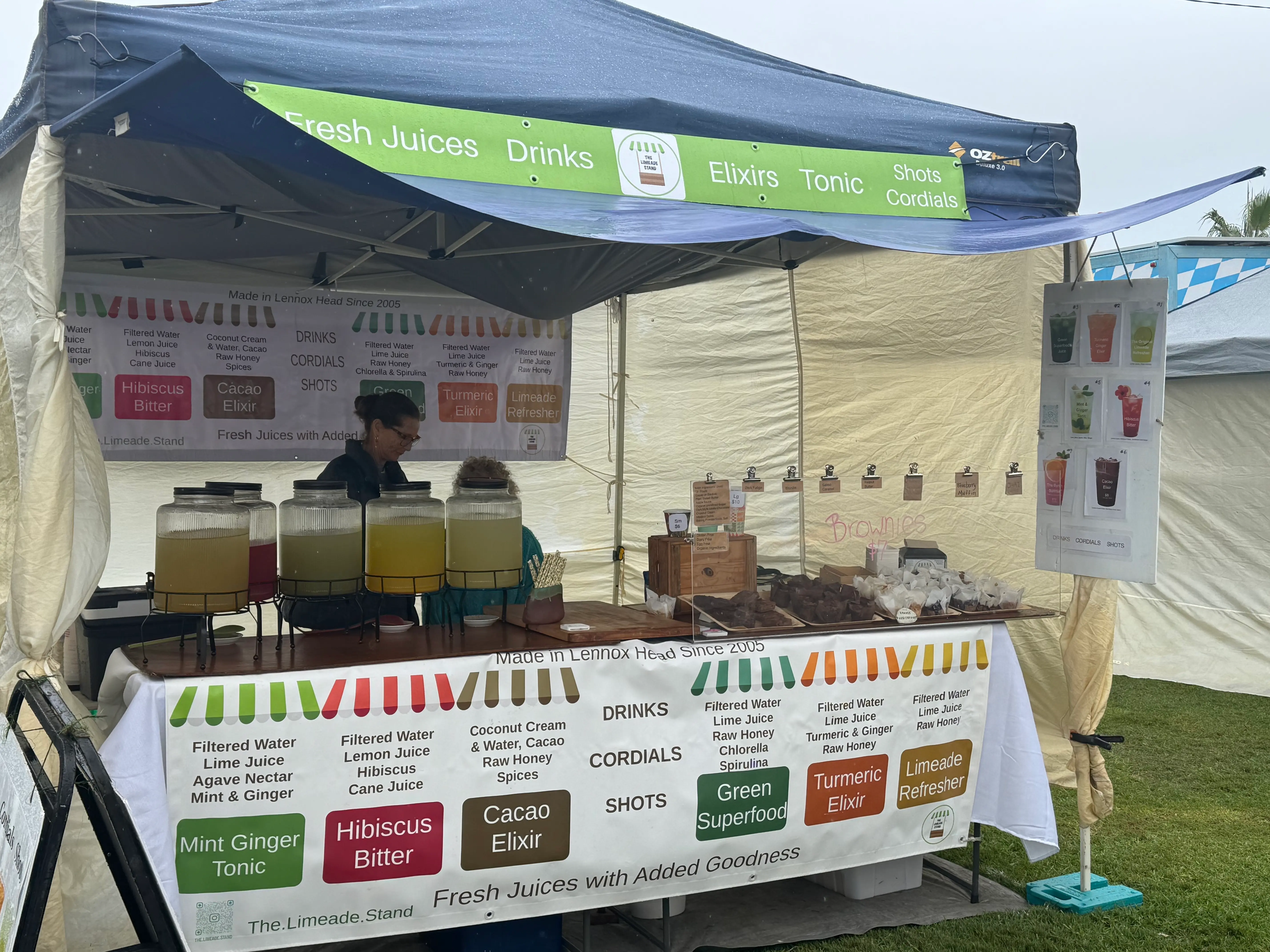 The Limeade Stand at Byron Community Market with drinks displayed at the stall