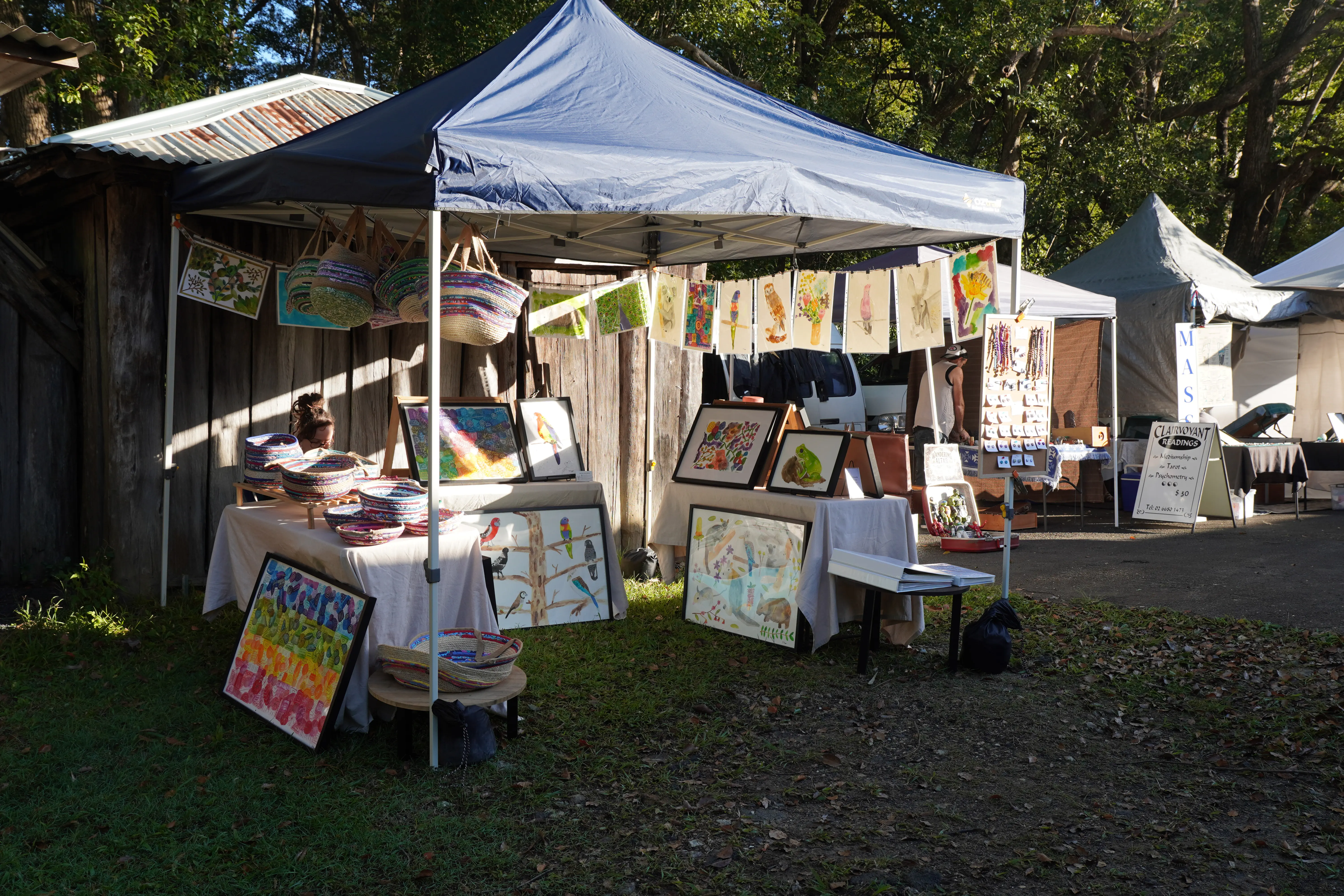 Market stall with handmade goods and clothing at Mullumbimby Community Markets